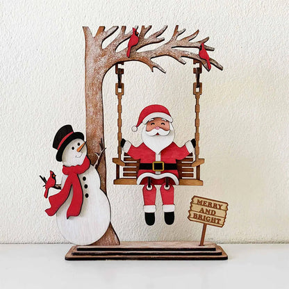 🎅60 % de réduction !!!🔥Acheter 1 Obtenez 1 Gratuit💝✨Décoration de table 3D en bois représentant le Père Noël sur une balançoire