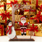 🎅60 % de réduction !!!🔥Acheter 1 Obtenez 1 Gratuit💝✨Décoration de table 3D en bois représentant le Père Noël sur une balançoire